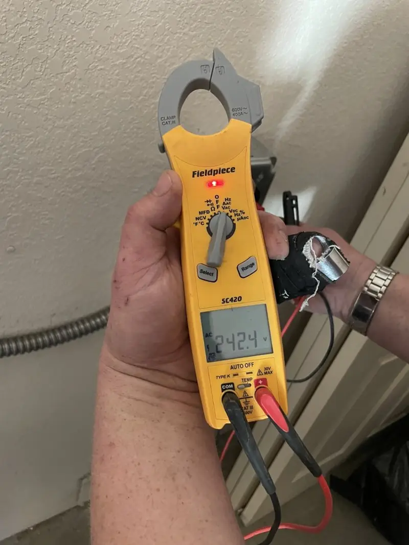 Voltage testing with clamp meter during Generator Installation in Doctor Phillips